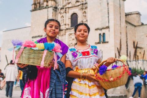 two hispanic girls with baskets
